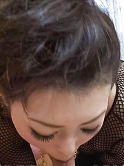 Yuki Asami Asian in fishnet strokes and rubs joystick with feet