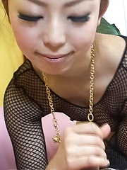 Yuki Asami Asian in fishnet strokes and rubs joystick with feet